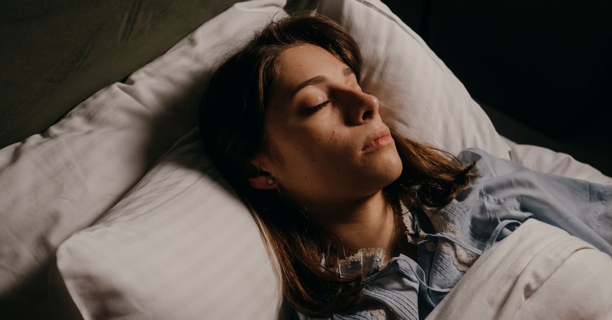 Woman learning how to choose a pillow that supports better sleep